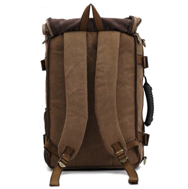 Large high quality canvas travel mountaineering backpack with multiple pockets and a comfortable three-strap system, ideal for outdoor adventures.