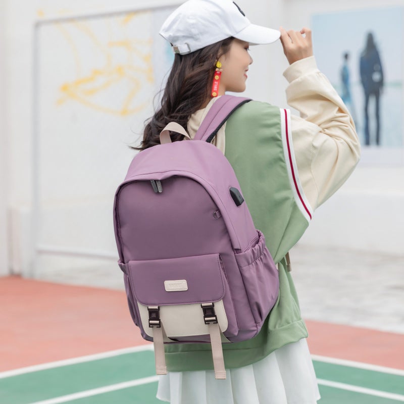 Large size fashion cute backpack for young ladies, made of durable nylon, featuring a plain pattern and spacious design.