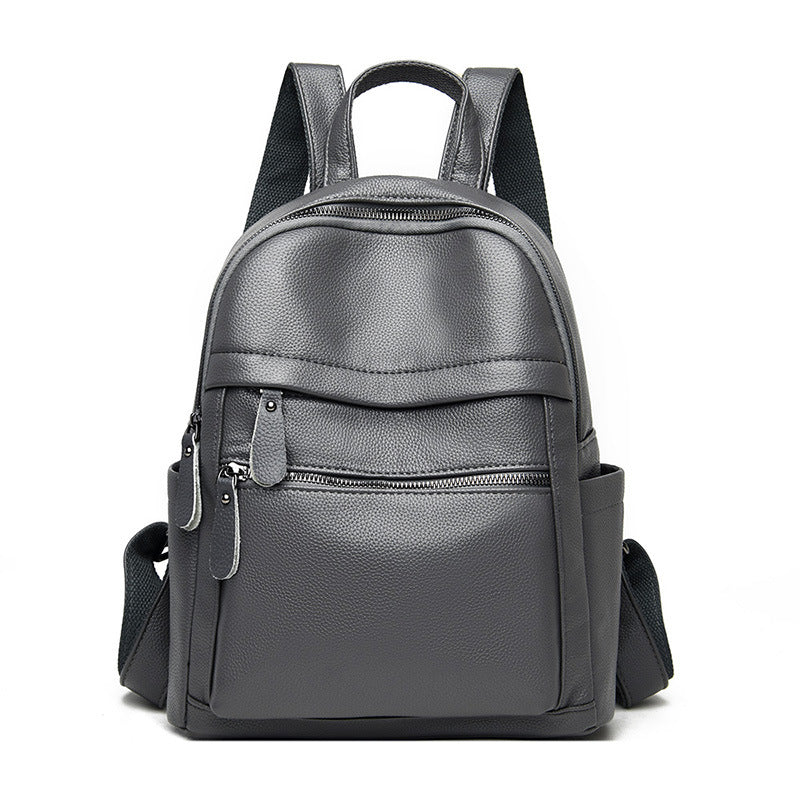 Large-capacity casual female fashionable backpack made of PU leather, featuring a stylish design with double root shoulder straps and multiple internal pockets.