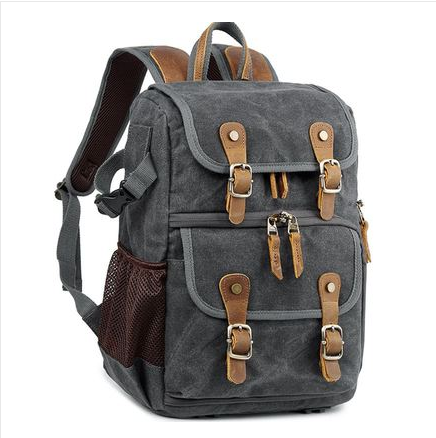 Leisure Canvas Photography Camera Backpack made of durable polyester and batik canvas, featuring multiple compartments for camera gear and a stylish design.