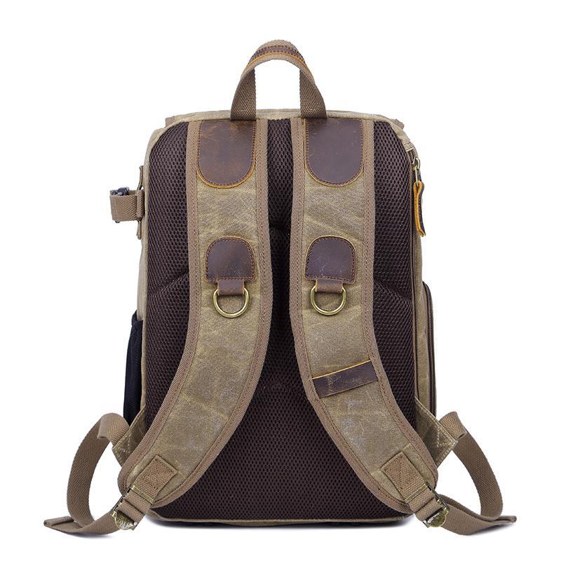 Leisure Canvas Photography Camera Backpack made of durable polyester and batik canvas, featuring multiple compartments for camera gear and a stylish design.