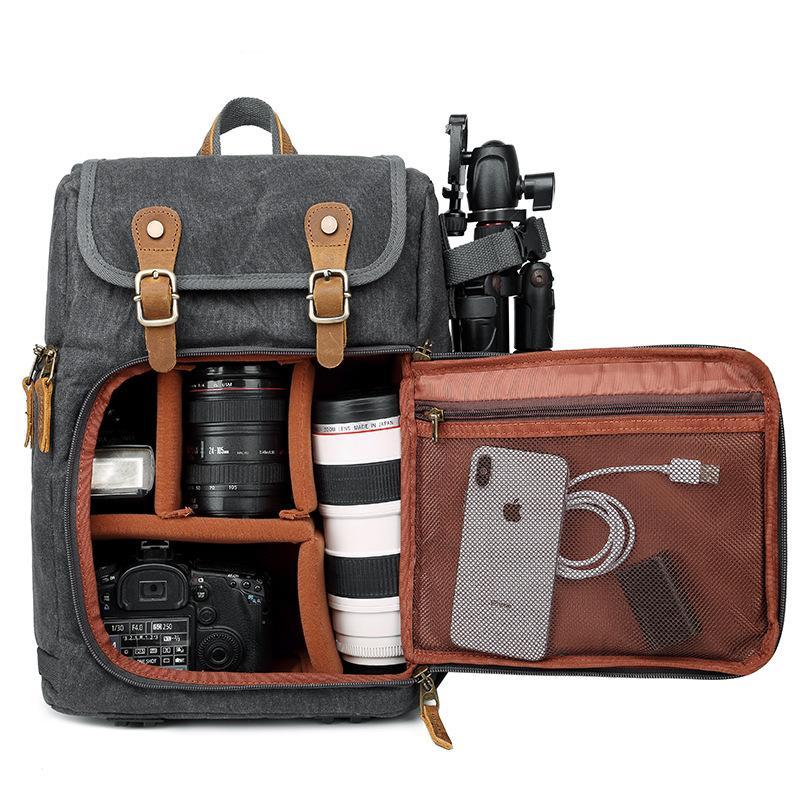 Leisure Canvas Photography Camera Backpack made of durable polyester and batik canvas, featuring multiple compartments for camera gear and a stylish design.