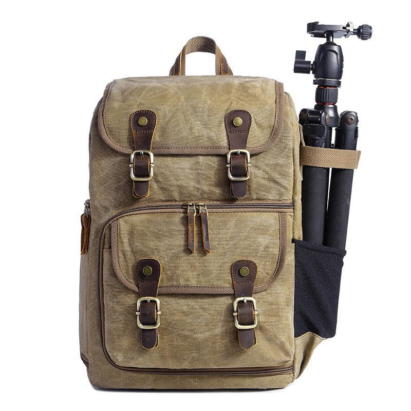 Leisure Canvas Photography Camera Backpack made of durable polyester and batik canvas, featuring multiple compartments for camera gear and a stylish design.