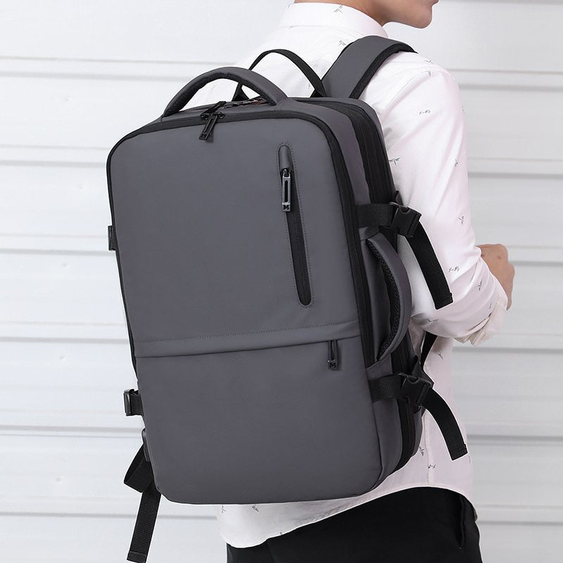 Man's Business Backpack made of high-quality nylon, featuring USB charging port and multiple compartments for organization.