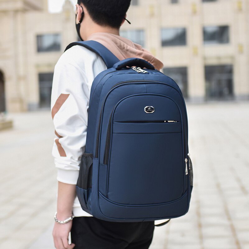 Men's multifunctional waterproof business backpack made of Oxford material, featuring multiple pockets and a stylish design.