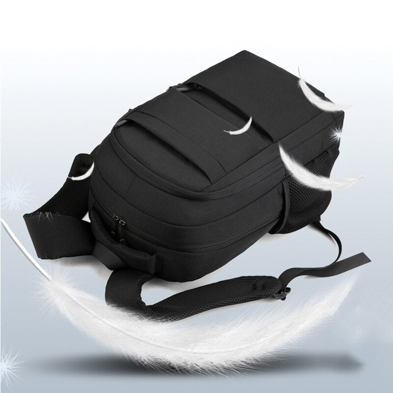 Men's multifunctional waterproof business backpack featuring USB charging port, made of durable nylon with multiple compartments.