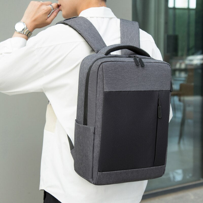 Men's multifunctional backpack with USB charging port, waterproof design, and multiple pockets for organization.