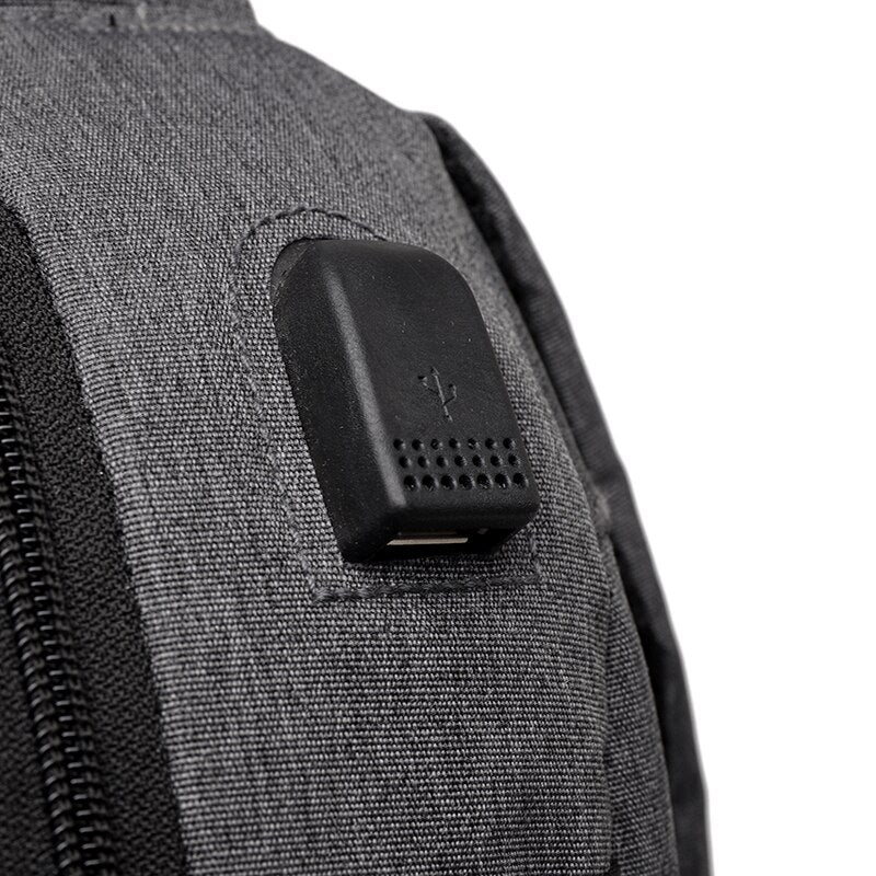 Men's Business Backpack featuring USB charging port, nylon material, and spacious compartments for laptops and essentials.