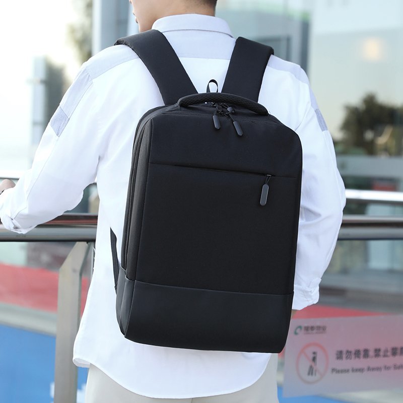 Men's Business Backpack in black nylon with USB charging port, featuring multiple compartments and a stylish design.