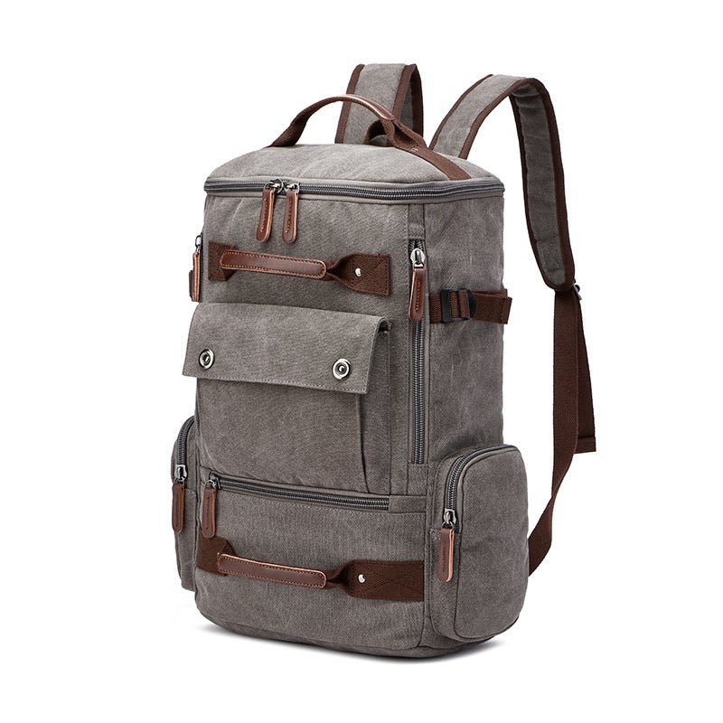 Men's vintage canvas backpack with leather accents, showcasing its large capacity and stylish design.