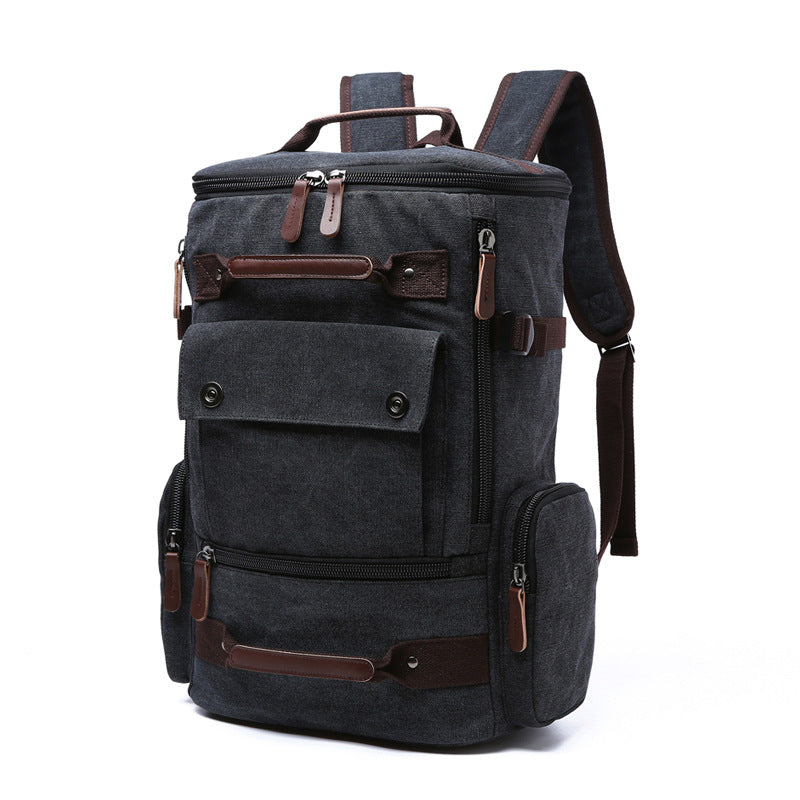 Men's vintage canvas backpack with leather accents, showcasing its large capacity and stylish design.