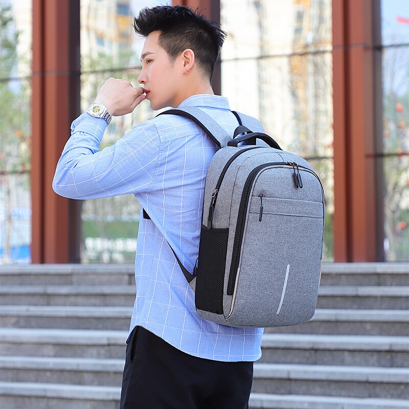 Mens Multifunctional Business Casual Rucksack with USB charging port, showcasing its sleek design and multiple pockets.