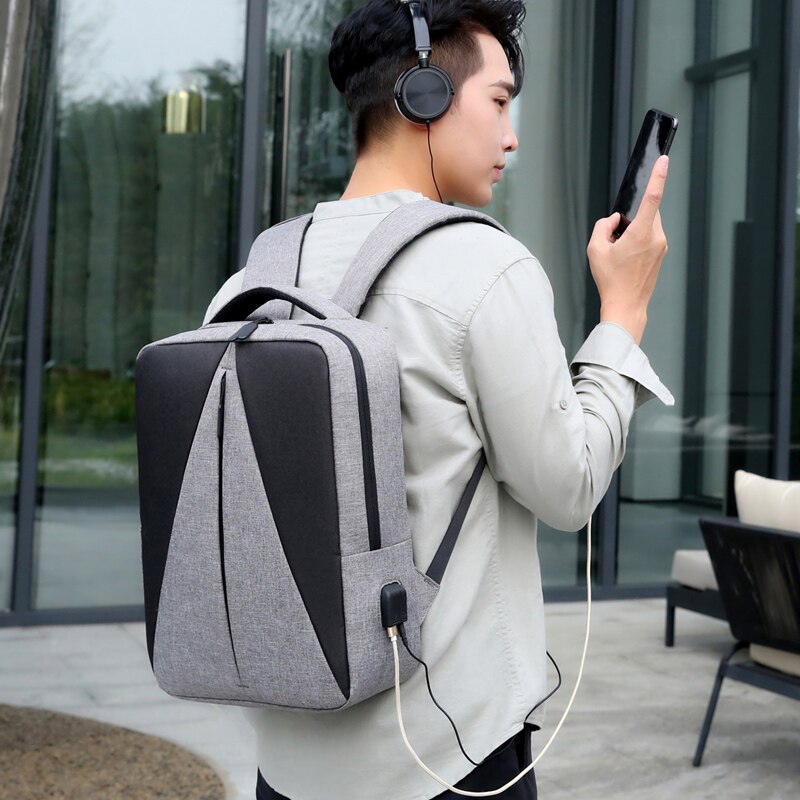 Mens Waterproof Oxford Cloth Backpack featuring USB charging port, multiple pockets, and stylish patchwork design.