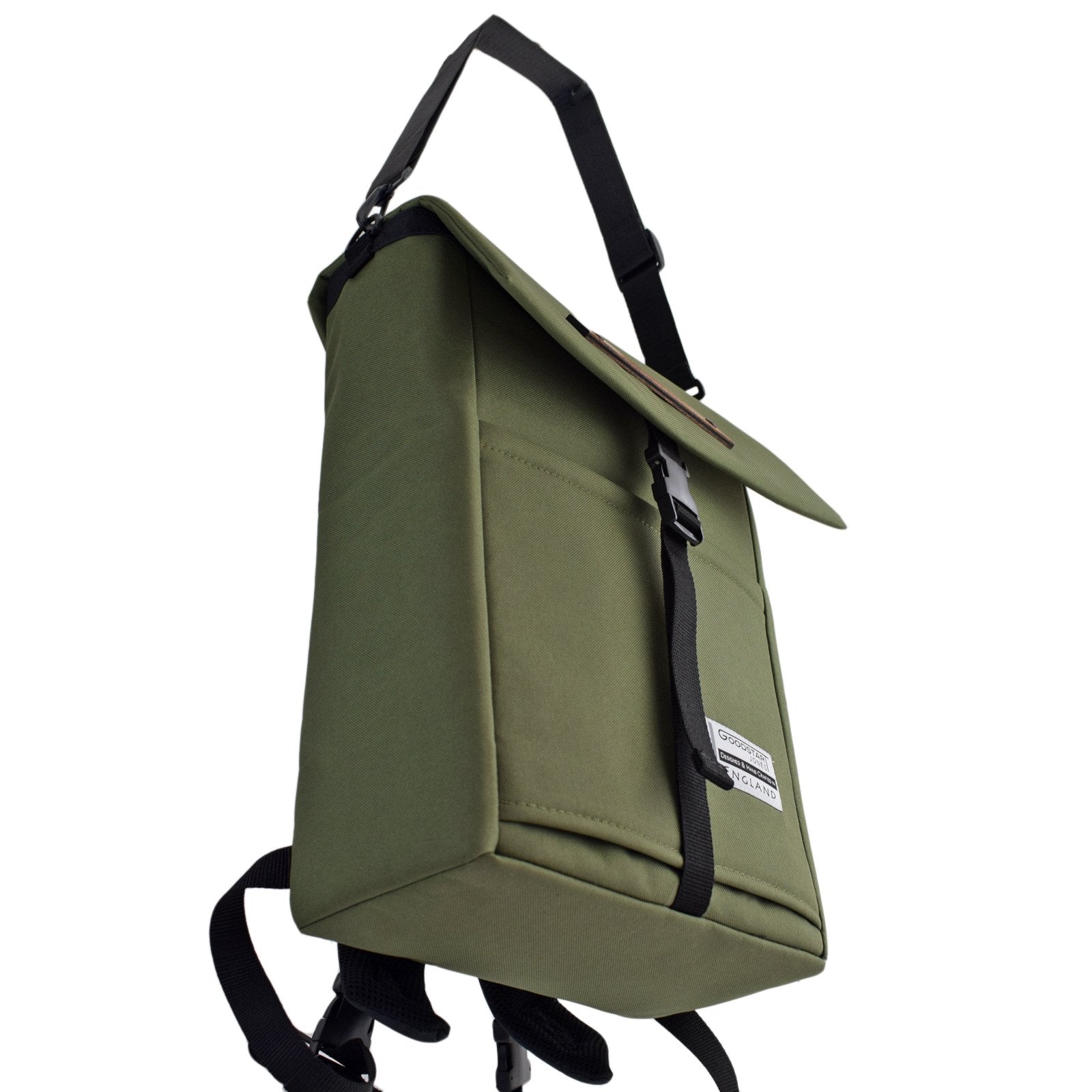 MERCHANT Backpack in Olive Green, showcasing its stylish roll-top design and durable materials.