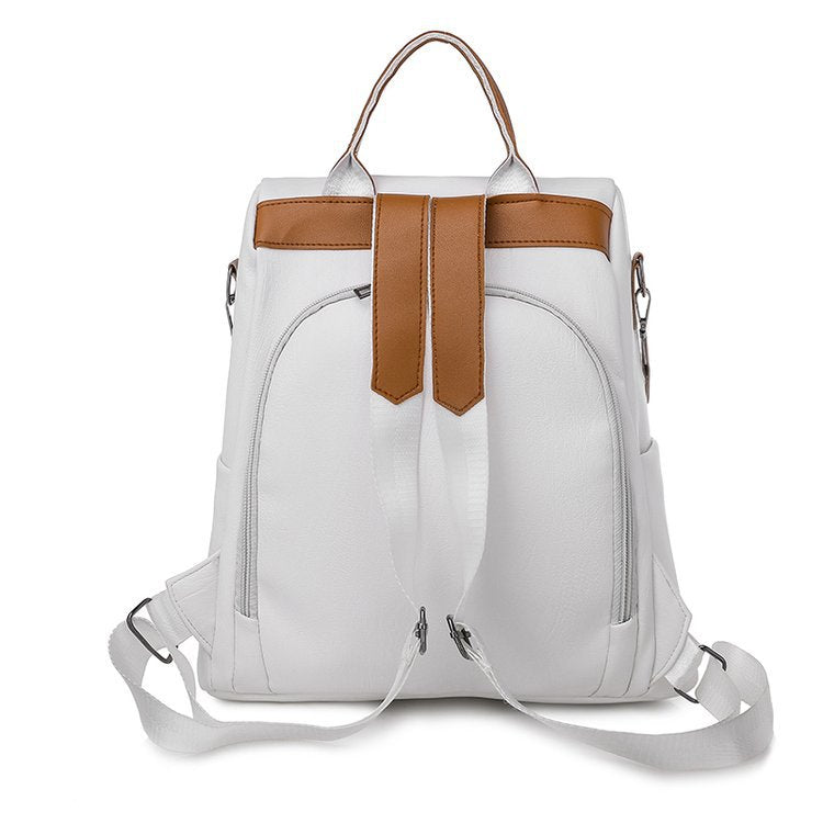 A stylish women's multifunctional anti-theft backpack made of PU leather, featuring multiple pockets and a secure zipper closure.