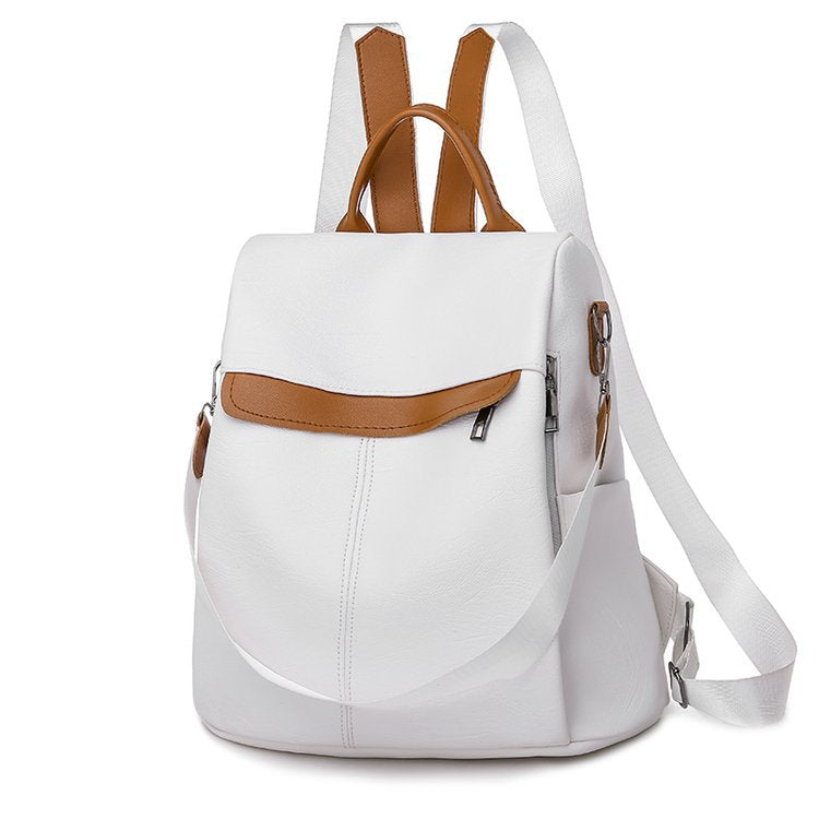 A stylish women's multifunctional anti-theft backpack made of PU leather, featuring multiple pockets and a secure zipper closure.