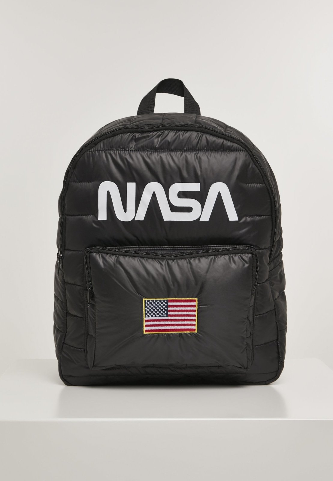 Stylish NASA Puffer Backpack featuring iconic NASA lettering and USA flag patch, designed in a puffer jacket style.