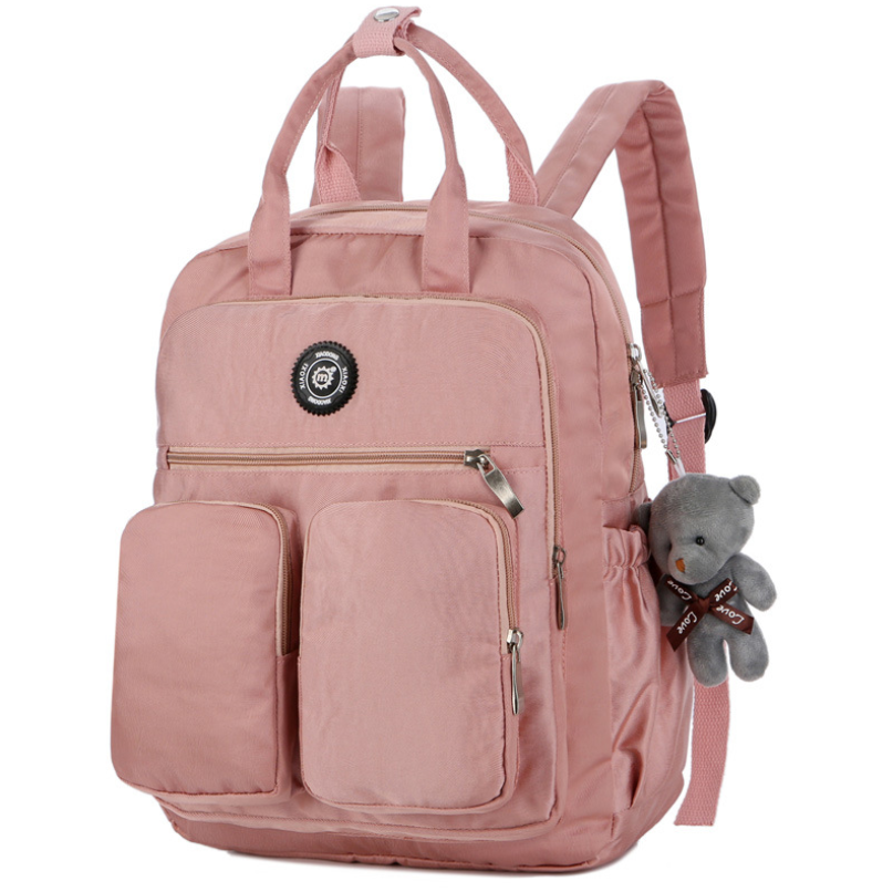 Nylon large capacity multi-function backpack featuring a cute toy bear, showcasing its spacious design and soft straps.