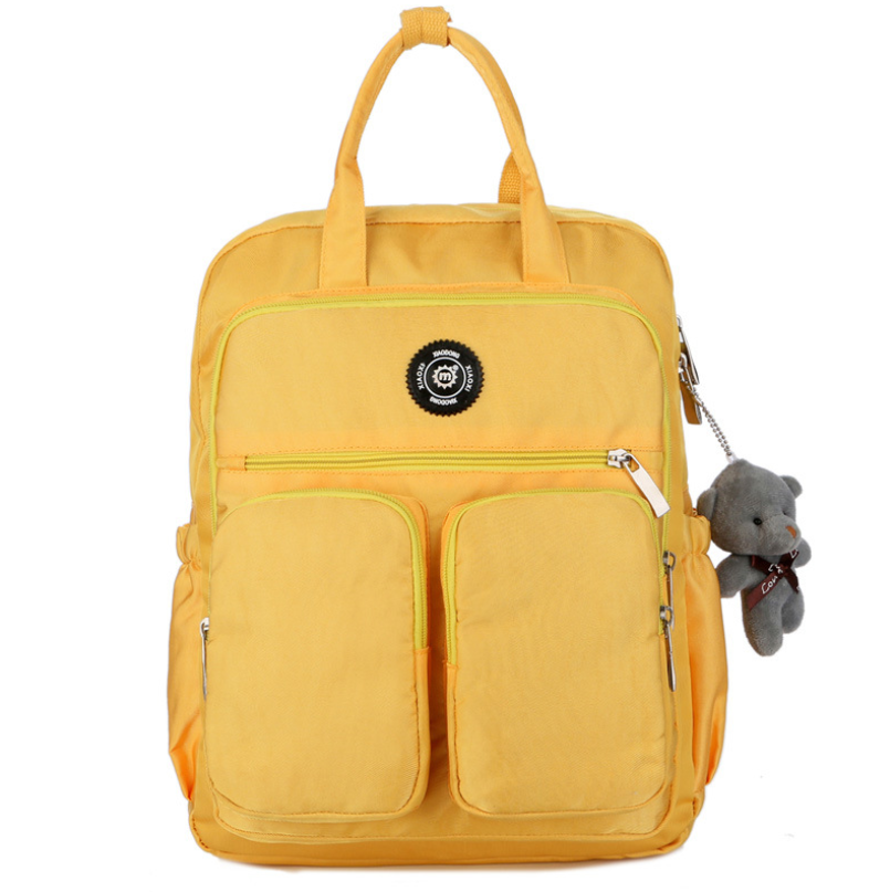 Nylon large capacity multi-function backpack featuring a cute toy bear, showcasing its spacious design and soft straps.