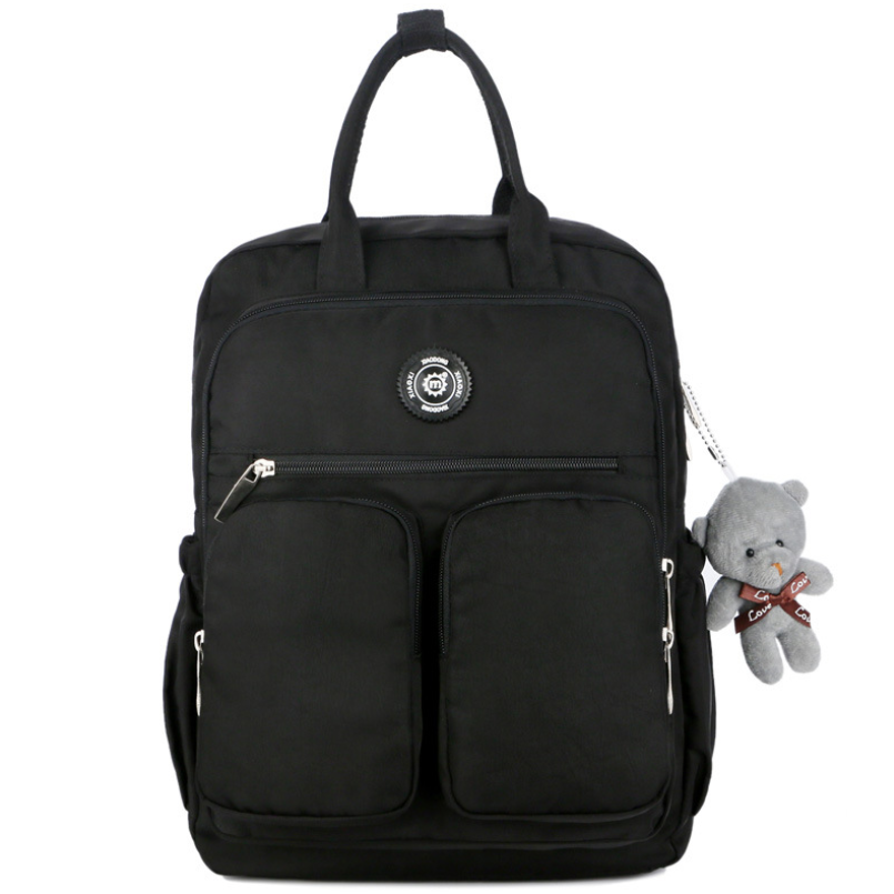 Nylon large capacity multi-function backpack featuring a cute toy bear, showcasing its spacious design and soft straps.