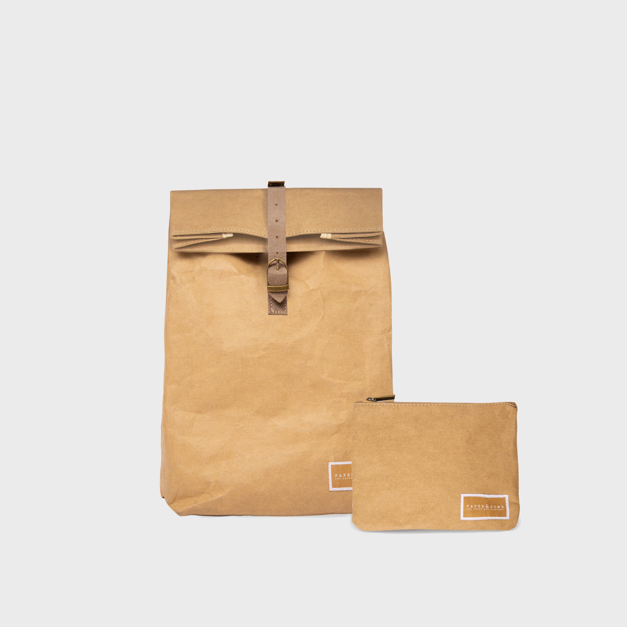 Oak Mini Bundle featuring a durable Kraft paper backpack and travel pouch, showcasing their water-resistant design and practical compartments.