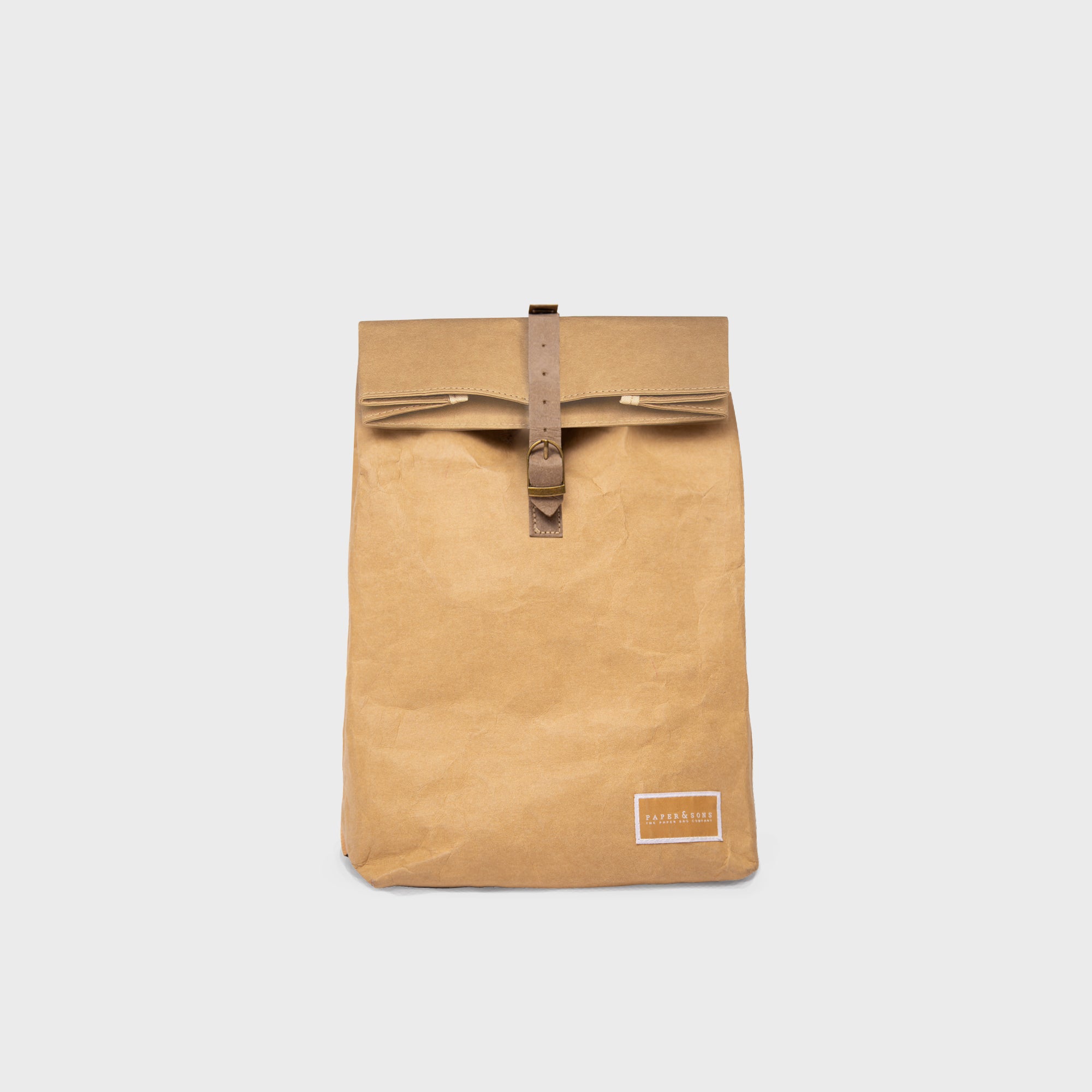 Oak Mini Bundle featuring a durable Kraft paper backpack and travel pouch, showcasing their water-resistant design and practical compartments.