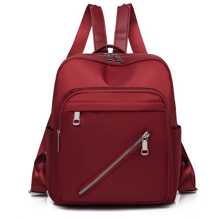 Oxford Cloth Women's Canvas Fashion Simple Backpack in solid color, featuring double shoulder straps and a soft handle.