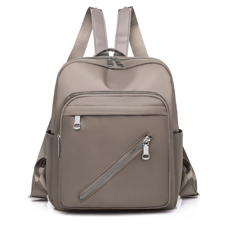 Oxford Cloth Women's Canvas Fashion Simple Backpack in solid color, featuring double shoulder straps and a soft handle.