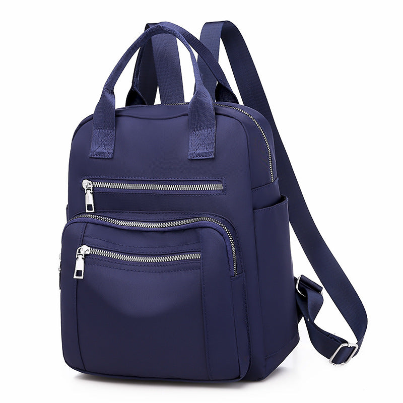 Oxford Dual-Purpose Spring Fashion Leisure Travel Backpack in stylish design, featuring multiple pockets and soft handle, ideal for travel and daily use.