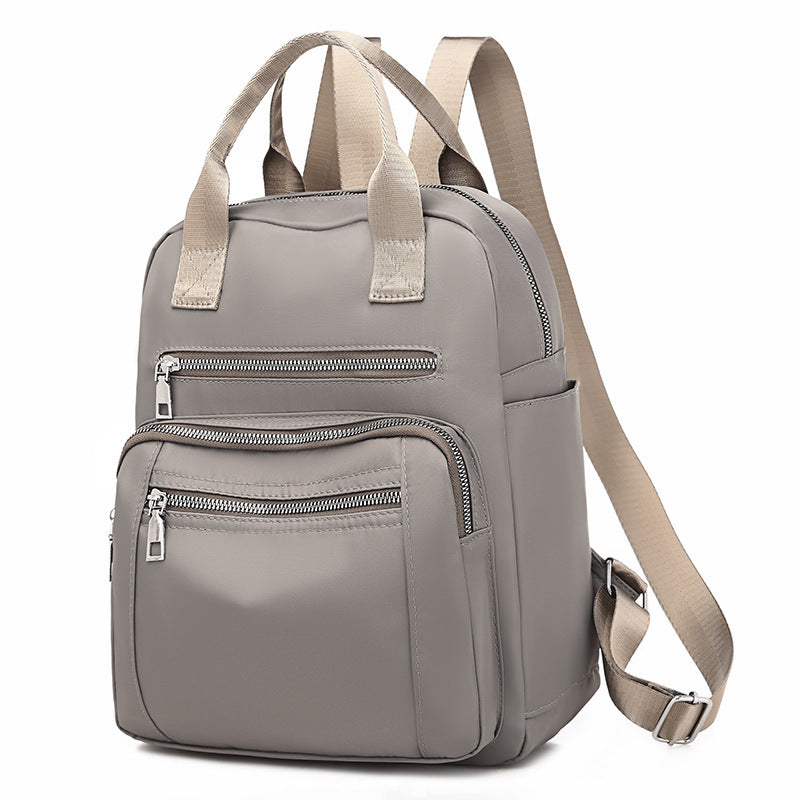 Oxford Dual-Purpose Spring Fashion Leisure Travel Backpack in stylish design, featuring multiple pockets and soft handle, ideal for travel and daily use.