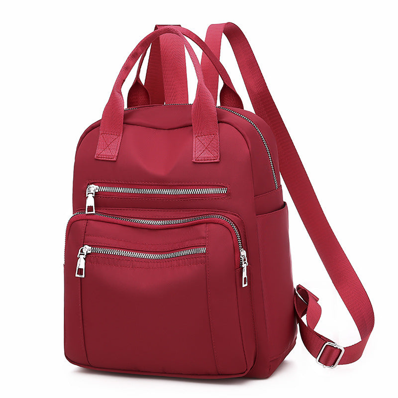 Oxford Dual-Purpose Spring Fashion Leisure Travel Backpack in stylish design, featuring multiple pockets and soft handle, ideal for travel and daily use.