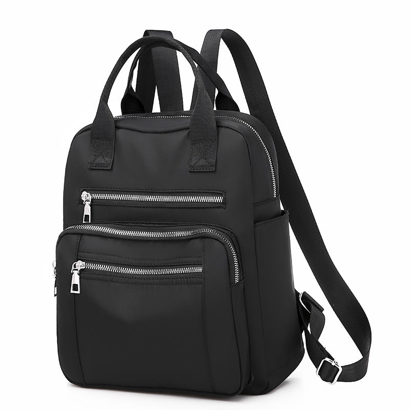 Oxford Dual-Purpose Spring Fashion Leisure Travel Backpack in stylish design, featuring multiple pockets and soft handle, ideal for travel and daily use.