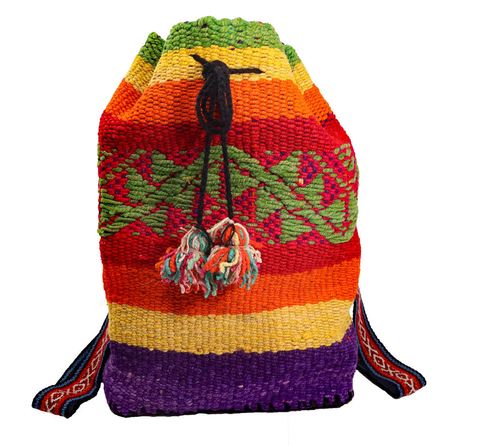 Pasos Cinch Style Backpack featuring vibrant green patterns, handwoven cotton and alpaca wool, with tassel ties and button closure.