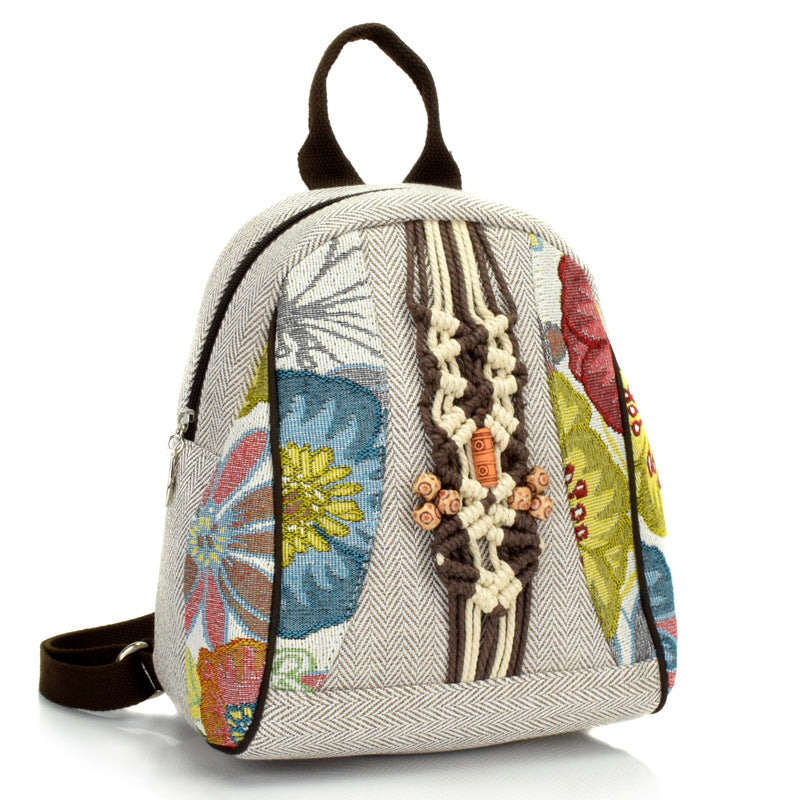 A stylish retro woven backpack for women made of cotton and linen, featuring a shell shape and multiple pockets.