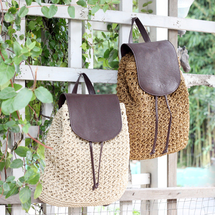 Stylish straw woven beach backpack with a soft fur cover, showcasing its cylindrical shape and intricate weaving.