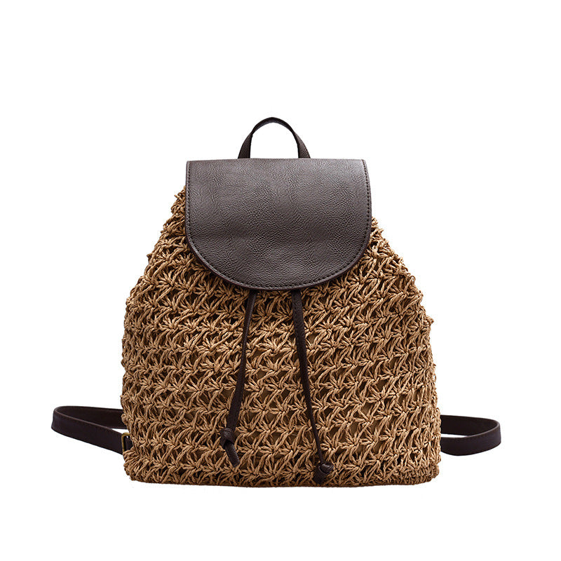 Stylish straw woven beach backpack with a soft fur cover, showcasing its cylindrical shape and intricate weaving.