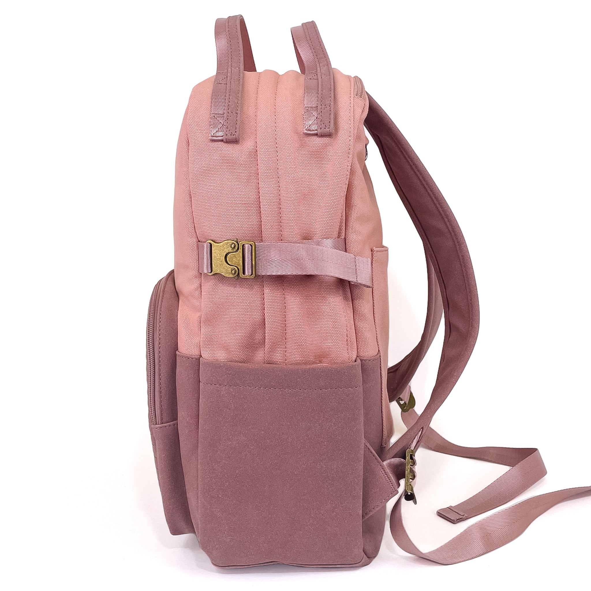 Stylish pink backpack with multiple pockets and a sleek design, featuring a secret back pocket and dedicated laptop compartment.