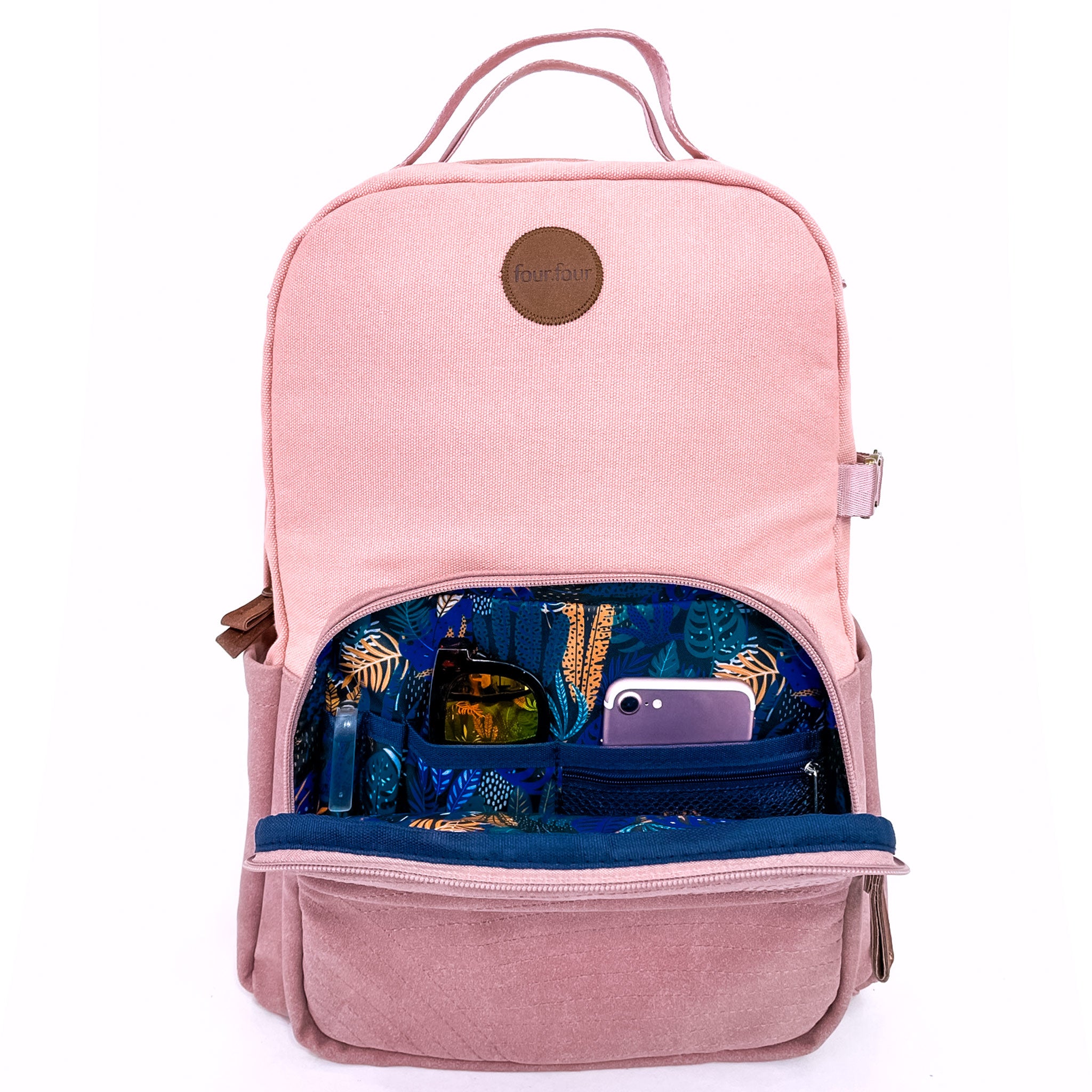 Stylish pink backpack with multiple pockets and a sleek design, featuring a secret back pocket and dedicated laptop compartment.