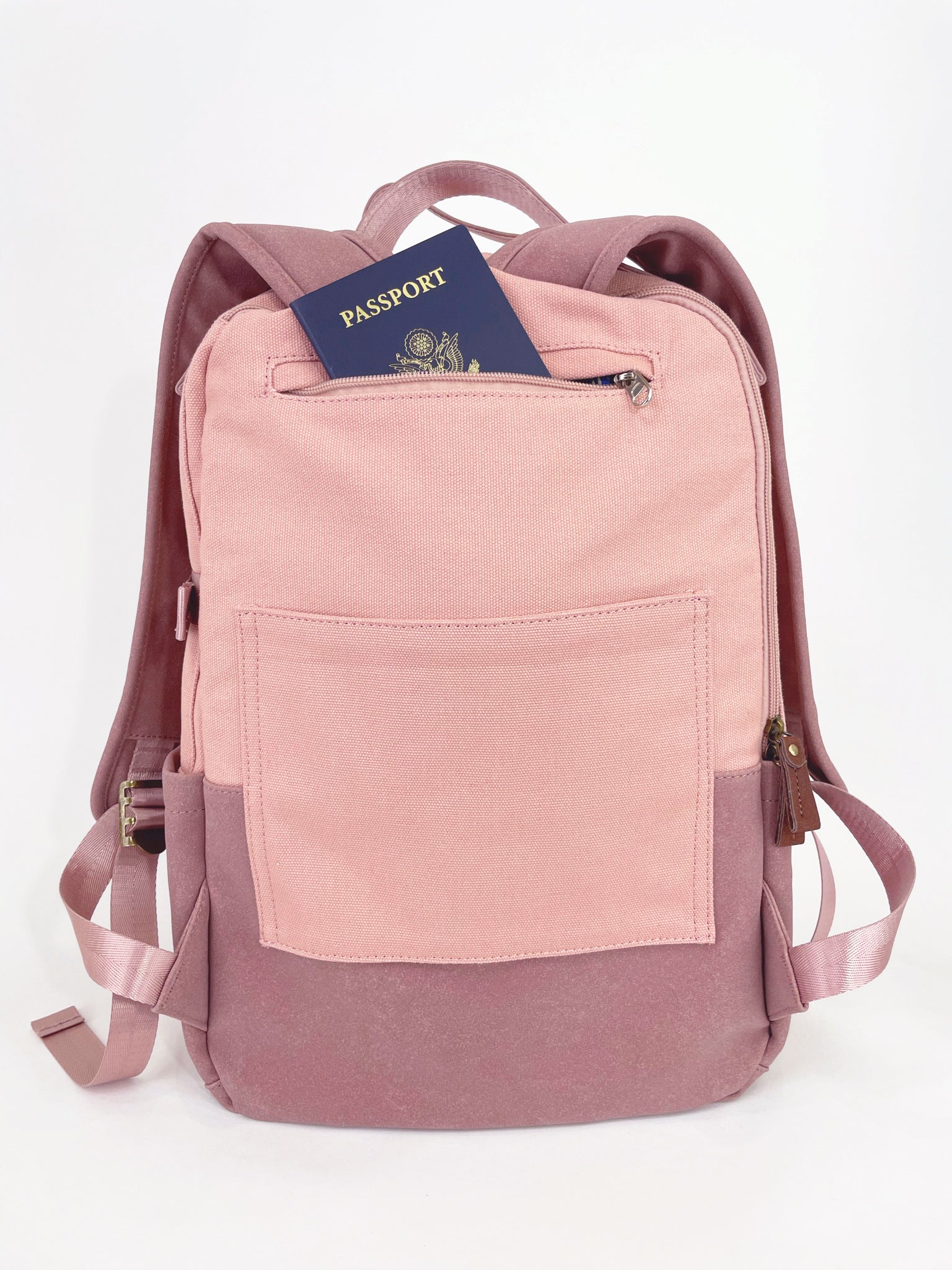 Stylish pink backpack with multiple pockets and a sleek design, featuring a secret back pocket and dedicated laptop compartment.