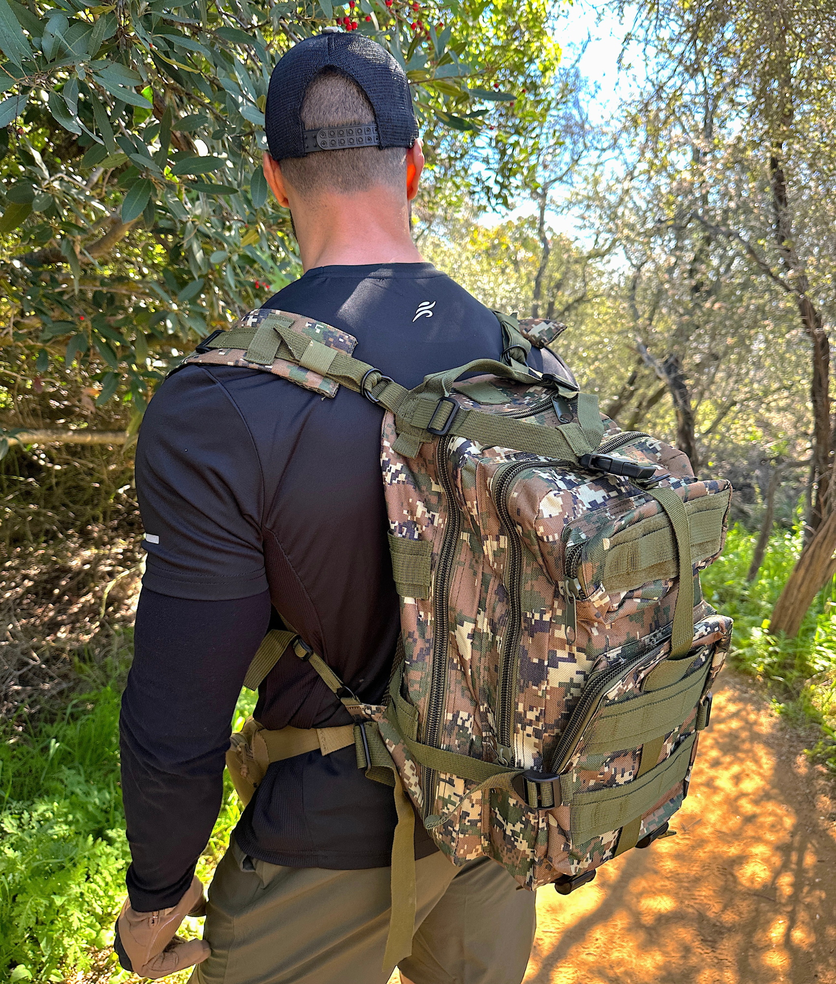 Tactical 25L Molle Backpack in olive green with multiple compartments and adjustable straps, ideal for outdoor activities and daily use.