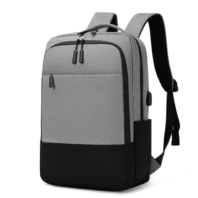 USB Charging Backpack for Men, waterproof and multifunctional with stylish patchwork design, featuring multiple pockets and USB charging port.