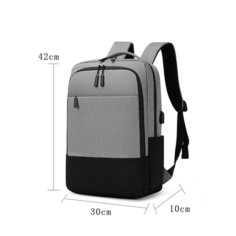 USB Charging Backpack for Men, waterproof and multifunctional with stylish patchwork design, featuring multiple pockets and USB charging port.