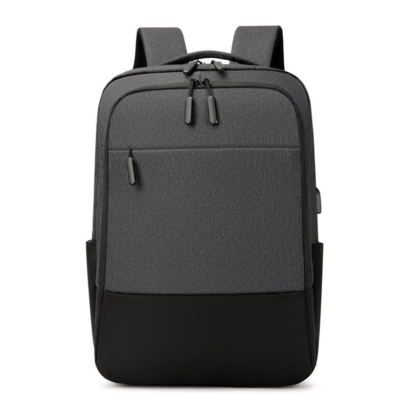 USB Charging Backpack for Men, waterproof and multifunctional with stylish patchwork design, featuring multiple pockets and USB charging port.