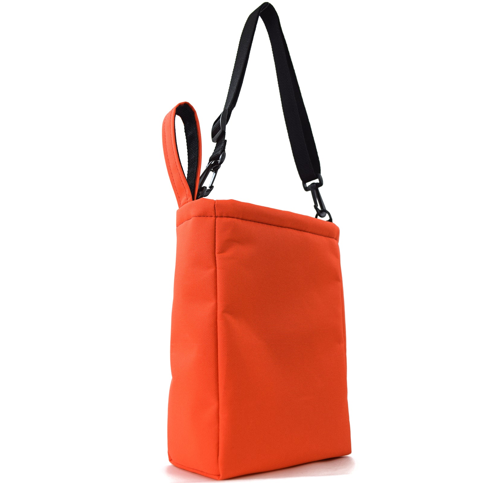 Bright orange UTILITY Pouch Grab Bag with cushioned interior and adjustable straps, ideal for organizing small items.