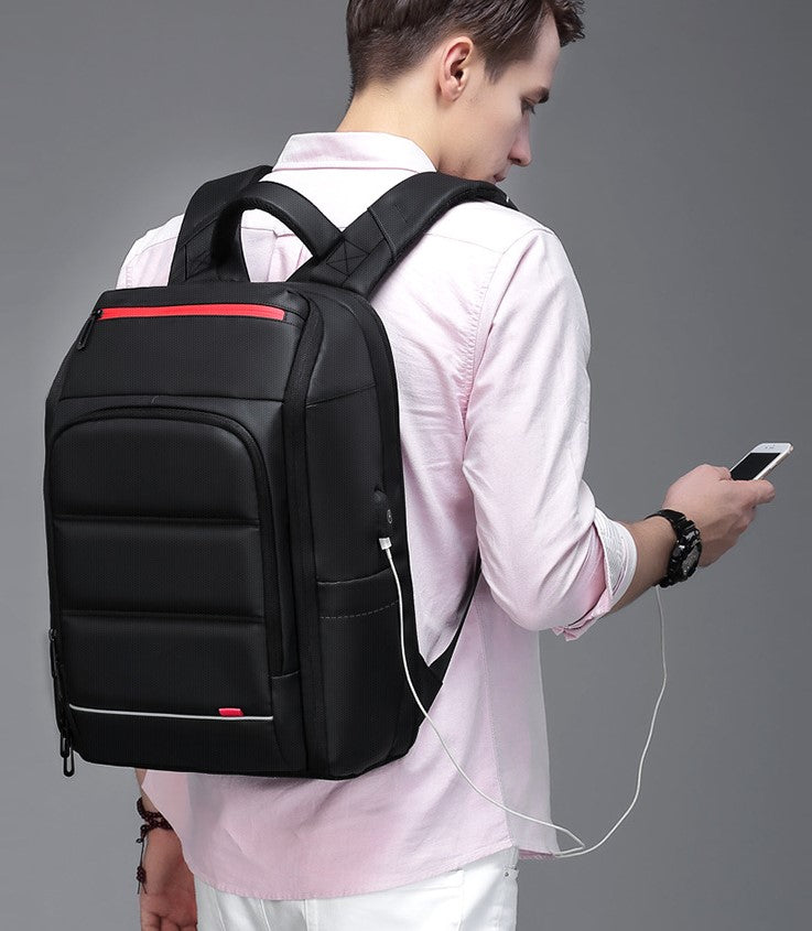 A stylish waterproof backpack featuring a multifunctional external USB port, designed for both men and women, showcasing its spacious compartments and modern design.