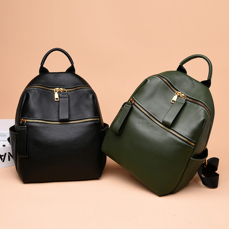 Women's All-Match Fashion Leather Small Backpack in green and black, showcasing its stylish design and genuine leather material.