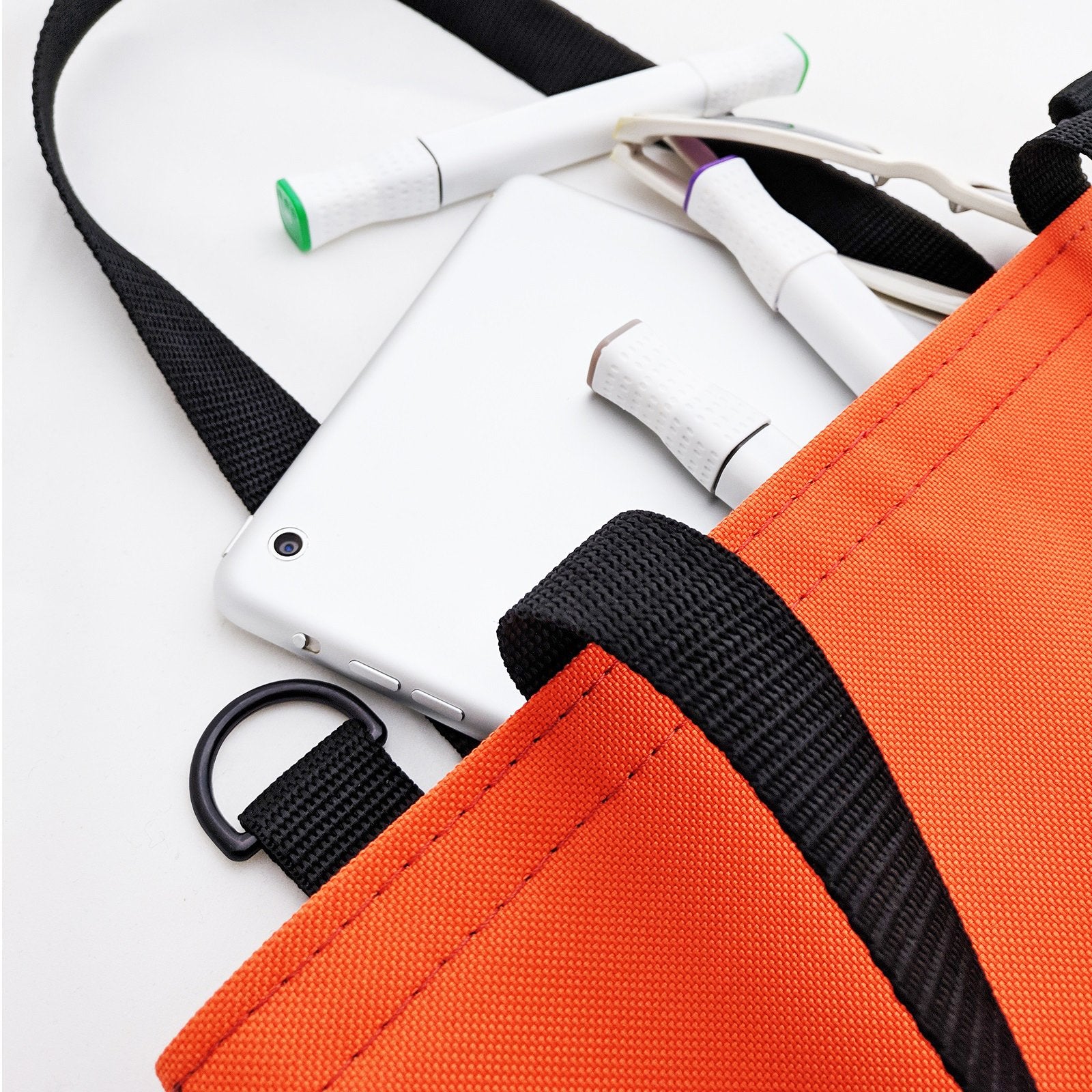 Orange WORK Tote Bag showcasing its compact and durable design, perfect for everyday use.