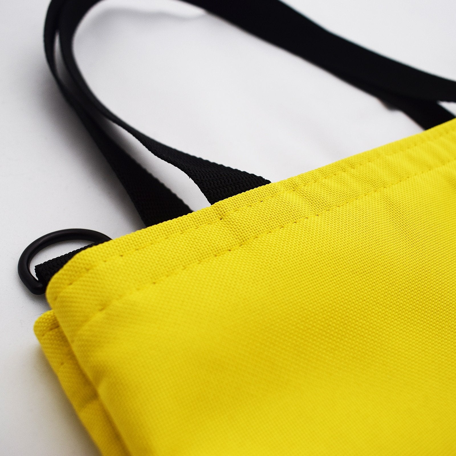 WORK Tote Bag in vibrant yellow, showcasing its compact and stylish design, perfect for everyday use.