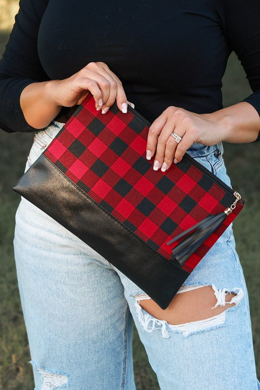 Clutch Tassel Handbag featuring camo and buffalo plaid patterns, made of vegan leather and canvas, showcasing a stylish tassel detail.