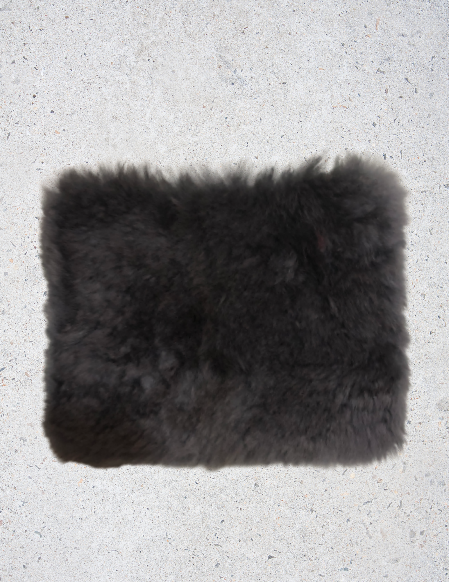 A luxurious Fur Wristlet made from soft baby alpaca fur, featuring a leather wristlet strap and zipper closure, available in Maroon, Navy, and Dark Grey.